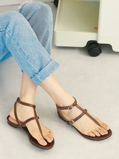 Editor's NotePretty yet comfy sandals will complete your summer look- Gladiator-like strappy sandals- Adjustable fit with the buckles on the straps- The ankle strap secures the feet- Flat design that goes with everything in the summerMeasurement (inch)- KR230(US 6)-KR255(US 8.5)- Height 0.4in.* Fits true to the size* Please refer to the size chartComposition & Care- Goat skin* Deformation or discoloring might happen if in contact with humid air or high temperature* Avoid rain and snow* Summer Strappy T-strap Sandals With Buckle Closure, Toe Post Strap Sandals For Spring, Spring Toe Post Sandals With Strap, Strappy Toe Ring Sandals With Removable Insole For Summer, Summer Toe Post Sandals With Buckle Closure, Spring T-strap Sandals With Adjustable Toe Post, Spring Toe Post T-strap Sandals With Adjustable Strap, Summer Open Toe Sandals With Buckle Closure, Summer Toe Ring Sandals With Buckle Closure