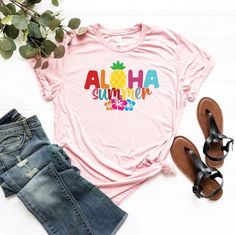 "Aloha Summer Hibiscus Shirt, Aloha Summer T-Shirt, Hawaii Vacation Shirt, Summer Trip Shirt, Aloha Tee, Cute Aloha Shirt, Tropical Shirt ☀️☀️☀️☀️☀️ Everything in our shop is hand crafted and made to order. If you want different color or size contact me! If you would like something custom made to fit your personal style please message me and I will do everything to get you that something special. ---How To Order--- ⭐️Please, check and review all photos ⭐️Choose your t-shirt size and color ⭐️Ente Multicolor Hawaiian T-shirt For Summer, Pink Tropical T-shirt For Summer, Tropical Multicolor T-shirt For Vacation, Multicolor Hawaiian T-shirt For Beach Season, Pink Hibiscus Print T-shirt For Summer, Pink Hawaiian T-shirt For Vacation, Pink Hawaiian Short Sleeve T-shirt, Pink Printed Hawaiian Summer Shirt, Pink Printed Summer Hawaiian Shirt