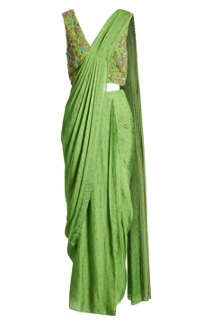 This saree has a hand-embroidered cropped top with intricate beadwork and lustrous sequins and is paired with a skirt featuring attached wraparound draping. This outfit is prestitched, so you can put it together in 30 seconds or less. 7 1/2" length (top) 52 1/2" length (bottom) (size Medium) V-neck Top has hook-and-eye closure; skirt has hidden side-zip closure Top and skirt feature hook-and-eye attachments for easy drape adjustments Lined 100% viscose Spot clean Made in India Asian & Pacific Is Embroidered Draped Traditional Wear For Diwali, Traditional Draped Sequin Dress, Festive Embroidered Draped Blouse Piece, Traditional Embroidered Draped Blouse Piece, Traditional Embroidered Draped Dupatta, Designer Embroidered Draped Saree, Draped Choli With Zari Work For Festivals, Traditional Embellished Pre-draped Saree In Raw Silk, Traditional Embroidered Draped Saree