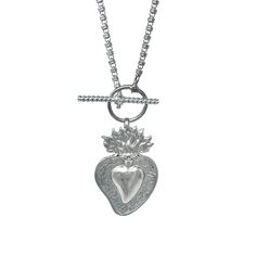 Based on a DelBrenna family design, our Flaming Heart pendant represents our passion for our craft. We love beauty, fashion, and sharing our creativity with you. This pendant calls you to open your heart and share your wonderful self with the world! Pendant in 925 silver with DelBrenna’s Signature Rhodium Finish. It is 2 1/4” in height and 1 1/2” wide. Its bail slides onto all DelBrenna chains up to 5mm. Chain sold separately. Flaming Heart, Italian Horn, Family Design, Open Your Heart, Family Heirloom, Earring Backs, Beauty Fashion, Jewelry Care, Heart Pendant