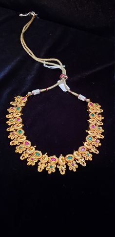 "Handmade Indian Temple Jewelry, best to wear it for traditional ceremonies or Indian wedding. This bridal jewelry has ethnic finish. It has Cubic Zircon stones with ruby and emeralds. It is a Bollywood style one gram jewelry. There are long and short patterns of Indian jewelry in Kundan, Pearls, CZ, American Diamond , ruby, emerald, Polki, kemp to suit every occasion of South Indian and North Indian weddings. Handmade Indian Jewelry item * Stunning Hand made Traditional jewelry set. * Necklace Brides Jewelry, Jewelry Emerald, Temple Jewelry, Indian Temple, Bollywood Style, Jewelry Pearl, Ruby Emerald, Indian Wedding Jewelry, Indian Weddings