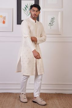 Cream straight kurta with scattered mirror embroidered buttis. Paired with a pant. - Aza Fashions Semi-stitched Chanderi Sherwani With Mirror Work, Chanderi Sherwani With Mirror Work, Fitted Cotton Churidar With Gota Work, Designer Chanderi Sherwani With Mirror Work, Fitted Straight Kurta With Dabka Work, Fitted Cotton Kurta With Mirror Work, Festive Unstitched Sherwani With Gota Work, Fitted Sets With Mirror Work For Eid, Fitted Cotton Salwar Kameez With Mirror Work