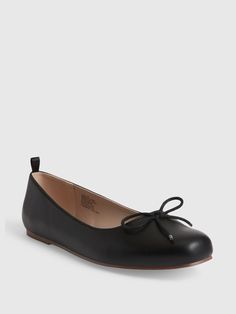 Smooth faux-leather ballet flats.  Rubber gripper sole.  Decorative bow at front.  For more fit & sizing info, check out our Size Guide.