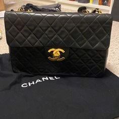 Vintage Chanel Black Maxi In Very Good Condition. No Card But Comes With Dust Bag. Serial Number Is Intact And Poshmark Will Authenticate. Tiny Bit Of Touch Up On Corners. I Think Only On 2. Hard To Tell. Please See All Pics. Gold Plating Is Great. Structure Is Great!! 13.25 Length And 9 In High. Price Is Firm On Here. Chanel Maxi, Vintage Chanel Bag, No Card, Bags Vintage, Chanel Bags, Black Maxi, Chanel Black, Vintage Chanel, Touch Up