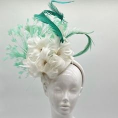 Handmade by Featured Milliner of The Kentucky Derby Museum 2023 & 2024! Cream feathery flowers with mint green feathers  Attaches with headband.  Not taking customs this year--Derby 150 is going to be massive and mom life keeps me running! However, happy to suggest pieces that will coordinate with your outfit. If you don't love the way this attaches to your head--message me!  I can swtich *most* pieces to your preference. Clip, Headband OR Elastic Cord  NOTE: Heavier pieces with extravagant florals etc require the stability of a headband. NO RETURNS/EXCHANGES due to nature of product (special occasion and head wear). Not all screens/lighting are created equal. Make sure you are happy with the color match before ordering! If you have any concerns, let me know--here to help. Just say the wor Feathered Headpiece For Royal Ascot Races, Ostrich Feather Mini Hat For Royal Ascot Races, Royal Ascot Mini Hats With Ostrich Feathers For Races, Spring Race Mini Hats With Ostrich Feathers, Summer Races Ostrich Feather Headpiece, Feathered Mini Hats For Royal Ascot Races, Mini Hats With Feathers For Royal Ascot Races, Royal Ascot Feathered Mini Hats For Races, Formal Mini Hats With Feather Trim For Spring