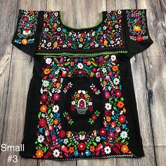 "Armpit to armpit 17\" Armhole 8\" Long 26\" Best fits Small may fit Median Completely handmade by Mexican artisans Embroidered by hand. Ready to ship!" Spring Folk Tops With Machine Embroidery, Spring Folk Style Tops With Machine Embroidery, Folk Style Spring Tops With Machine Embroidery, Fitted Traditional Tops With Geometric Embroidery, Fitted Tops With Geometric Embroidery In Traditional Style, Embroidered Fiesta Blouse, Fitted Multicolor Floral Embroidered Top, Black Tops With Floral Embroidery For Festivals, Black Cotton Tops With Intricate Embroidery