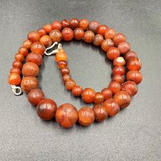 The Beautiful Roman's Era Dynasty Red Carnelian Agate Stone Jewelry Beads Necklace. The Age Of This Beads Are More Than 2000 Years Old. Conditions Of Beads As Shown In The Pictures. Rich In Patina. Red Carnelian Large Beads, Red Carnelian Round Beads, Red Large Carnelian Beads, Large Red Carnelian Beads, Carnelian Gemstone Beads Necklace, Polished Round Carnelian Beads, Gems, And Cabochons, Carnelian Gemstone Beaded Necklaces, Red Polished Carnelian Beads, Carnelian Beaded Necklaces With Gemstone Beads