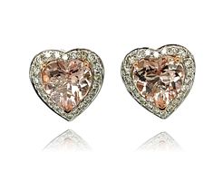 These adorable Heart shaped Morganite stud earrings have a halo of shimmering diamonds around them. The center stone has three prong setting in Rose gold for the perfect accent. There is a double push lock closure for extra security. These earrings come in a beautiful box ready for the perfect gift! 14KW:                    3.75 gms Morganite wt:     4.56 cts, heart shape Diam wt:              0.63 cts Diam stones:       116 round, brilliant cut, Color: I, Clarity SI Free shipping within the US! Usually ships within 1-2 business days Retail value: $4,350 Hassle free 14 day return policy...No questions asked! Morganite Earrings, Morganite Diamond, Rose Gold Heart, Heart Shaped Earrings, Diamond Stud Earrings, Diamond Stud, Morganite, Diamond Earrings Studs, High Quality Jewelry