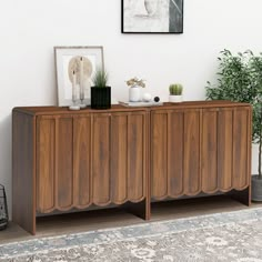 the sideboard is made from wood and has two doors