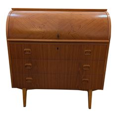 a wooden dresser with three drawers on one side and an open drawer on the other