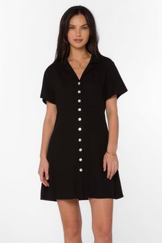 A must-have for any fashion-forward woman, the Sirina Dress is a versatile addition to your wardrobe. This button-up dress features a v-neck, short sleeves, and a lapel collar, elevating the classic design. Look stylish in this timeless piece. Material: 100% Linen Machine wash cold or hand-wash Color: Black Model is 5'9" and wearing a size XS Imported Button Up Dress, Black Model, Look Stylish, New Tops, Lapel Collar, Xl Dress, Dresses Xs, Jacket Outfits, Outerwear Jackets