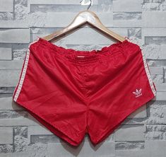 Welcome to our store.  Antique Adidas shorts Size: 6/ L/XL/ Vintage Small Logo Adidas/ Authentic 80s 90s sport striped pattern track style activewear stripes Short Please make sure of the measurements and do not be satisfied with the written sizes because they differ from country to country. Tagged Size: 6/ L/ XL Belt: 40-50 cm/ 15-19 Length: 27 cm/ 10.6 inch Condition:          8/10 Perfect condition. This item is used but in good condition. If there are any nuances - they will be listed in the Summer Sportswear Shorts With Side Stripes, Summer Sportswear Shorts With Three Stripes, Casual Athletic Shorts With Side Stripes For Summer, Casual Summer Athletic Shorts With Side Stripes, Summer Athletic Shorts With Three Stripes Branding, Summer Streetwear Shorts With Three Stripes Branding, Sportswear Shorts With Three Stripes For Summer, Sporty Striped Shorts For Sports, Casual Striped Sports Shorts