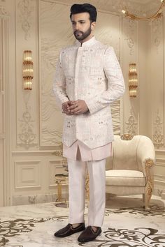 Introducing our R14-S61 Sherwani, the pinnacle of elegance and luxury. Handcrafted with seamless buttons, intricate thread work and shimmering sequins, this garment exudes sophistication and exclusivity. Step into a world of art and fashion with this premium sherwani. Fitted White Nehru Jacket With Mirror Work, Bollywood Style Festive Sherwani With Sequins, Diwali Sequin Sherwani Unstitched, Diwali Unstitched Sequined Sherwani, Designer Bandhgala With Mirror Work, Designer Nehru Jacket For Eid Reception, Designer Embellished Kurta For Eid, Unstitched Sequined Sherwani For Diwali, Diwali Sequins Bandhgala With Long Sleeves