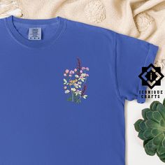 Comfort Colors Flower Embroidered Shirt, Floral Tee, Floral Sweatshirt, Flower T-shirt, Wild Flower sweatshirt, Wildflower Tee, Gift for her This listing is for an embroidered shirt, making it a luxurious choice. Embroidery adds a premium, tactile quality to your item, offering a more refined and durable finish compared to other methods. Explore more fun and unique designs at https://www.etsy.com/shop/iconiquecrafts/ SHIPPING TO HAWAII OR ALASKA Please contact us before ordering if you live in A Blue T-shirt With Embroidered Text For Spring, Blue Crew Neck Tops With Floral Embroidery, Blue Crew Neck Top With Floral Embroidery, Blue Floral Embroidered Crew Neck Top, Relaxed Fit Crew Neck Tops With Floral Embroidery, Casual Crew Neck Shirt With Machine Embroidery, Cotton Floral Embroidery Short Sleeve Shirt, Cotton Short Sleeve Shirt With Floral Embroidery, Relaxed Fit Floral Embroidery Tops With Crew Neck