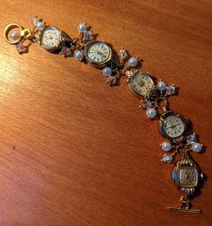 "FUN! This is a bracelet made from vintage watches dating from the 1930s and up. There are a variety of watches used; this one includes Helzberg 10k RGP, Benrus 10k RGP, Devon 10k RGP and Bulova 10k RGP. I just love the different shapes of the watches! I've used faux pearls and clear crystals in this bracelet.  The bracelet measures about 1/2\" wide and 7.25\" long but can be shortened or lengthened to your specifications, simply send me a message. Each of my pieces are one of a kind, unique pie Luxury Vintage Handmade Watch Accessories, Antique Adjustable Jubilee Bracelet, Timeless Metal Bracelets For Wedding, Adjustable Heirloom Jubilee Bracelet, Vintage Nickel Free Bangle Jewelry, Vintage Nickel-free Bangle Jewelry, Nickel Free Vintage Bangle Jewelry, Vintage Bangle Bracelets For Wedding, Adjustable Victorian Bracelet For Anniversary