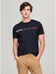 Tommy Hilfiger men's T-shirt. Made from lightweight cotton jersey, known for its breathability and stretch, our comfortable crewneck tee is cut in an easy fit and finished with our Tommy Stripe graphic.  Material: 100% Cotton. Modern Crew Neck T-shirt With Text Print, Tommy Hilfiger Sporty T-shirt With Graphic Print, Tommy Hilfiger Sporty Graphic Print T-shirt, Tommy Hilfiger Sporty T-shirt For Summer, Tommy Hilfiger Sporty Summer T-shirt, Tommy Hilfiger Relaxed Fit T-shirt With Graphic Print, Tommy Hilfiger Cotton T-shirt With Text Print, Tommy Hilfiger Cotton T-shirt With Letter Print, Tommy Hilfiger Blue T-shirt With Letter Print