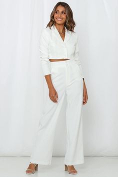 Length from shoulder to hem of size S: 38cm. White cropped blazer. Lined.  Cold hand wash only. Model is a standard XS and is wearing XS. True to size. Non-stretchy woven fabric. Button-through front. Internal shoulder padding.  Polyester/Elastane. MOSSMAN's The Last Goodbye Blazer is a modernised version of a beloved business staple. Made for all Boss ladies and confident women, this cropped style showcases a sleek structured fit in a pristine white finish, with a single-breasted button front. Take your look to the next level and style it with the brand's matching pants. Tailored Spring Pantsuit With Lapel Collar, White Long Sleeve Pantsuit For Spring, Summer Workwear Cropped Jacket, White Long-sleeve Summer Pantsuit, White Long Sleeve Pantsuit For Summer, White Long Sleeve Summer Pantsuit, Semi-formal Cropped Blazer For Spring, Tailored Long Sleeve Summer Blazer, Semi-formal Cropped Spring Blazer