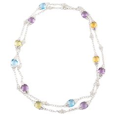 Amazing, Unique 14k White Gold Chain Necklace Features Amber, Blue, and Lilac-Colored Briolette-Cut Topaz in Alternating Pattern w/ Flower-Shaped Stations Set with a Round-Cut Diamond. Each Briolette Station is Set with Eight Small Round-Cut Diamonds Total Length = 37" Each Briolette Station Approximately 23 mm Long Each Flower Station Approximately 11 mm Long Total Topaz Weight = Approximately 67 carats Total Diamond Weight = Approximately .50 carats Chain Ideas, White Gold Chains, Lilac Color, Diamond Gold, Multi Strand Necklace, Gold Chain Necklace, Green Stone, Round Cut Diamond, Multi Strand