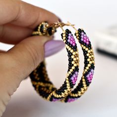 Wonderful purple hoop earrings  will be great birthday gift for women. This earrings is made of highest quality Japanese Toho beads. â¿ Diameter of hoops : 2.2 inch â¿ 100% handmade. â¿ Packed in gift bag. You will receive the same piece as pictured!!! Piece of my soul, which I left in this work, will warm you even in the most difficult and sad days. I am sure; this earrings will become your lucky charm that you would enjoy wearing day and night. Seed Bead Hoop Earrings, Unique Hoop Earrings, Bead Hoop Earrings, Hoop Earrings Large, Thick Hoop Earrings, Oversized Earrings, African Earrings, Toho Beads, Birthday Gift For Women