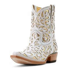 a pair of white cowboy boots with wooden soles and intricate design on the side