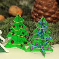 three christmas trees made out of construction paper