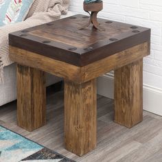 a small wooden table sitting in front of a couch