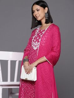 Grab this beautiful 3-piece set. The set comes with bandhani print & floral embroidery straight cut kurta has round neck, 3/4th sleeves & calf length teamed with printed trouser pant with elasticated waistband & slip-on closure and a silk chiffon dupatta with lace detailing. Color - Pink Kurta Fabric-Cotton Bottom Fabric-Cotton Dupatta Fabric - Silk Chiffon Neck-Round Neck Sleeves-3/4th Sleeves Work - Bandhani Print & Floral Embroidery Detailing Washing Instructions-Machine Wash DISCLAIMER - The color of the product may be differ due to screen settings of device. A misprint here and a color drop slip there is the beauty of printing which is not treated as a defect. Straight Kurta Bandhani Print Palazzo Set For Festivals, Diwali Bandhani Print Palazzo Set With Straight Kurta, Bandhani Print Palazzo Set With Straight Kurta For Festivals, Festive Bandhani Print Unstitched Suit With Straight Kurta, Chanderi Sharara With Bandhani Print, Designer Bandhani Print Salwar Kameez, Diwali Bandhani Print Georgette Salwar Kameez, Transitional Bandhani Salwar Kameez, Bandhani Print Semi-stitched Churidar