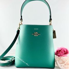 100% Authentic Brand New With Tag Sold Out In All Stores Excellent Gift - Includes Gift Bag Nwt Coach Small Town Bucket Bag In Beautiful Jade Color Soft Leather With Pink Interior. [Bag] Color: Gold/Bright Jade Double Face Leather Center Zip Compartment Snap Closure Handle With 6 3/4" Drop Detachable Strap With 22" Drop For Shoulder Or Crossbody Wear 8 1/2" (L) X 8 3/4" (H) X 4" (W) Includes:Coach Price Tag,Care Card & Gift Bag Fast Shipping Smoke-Free Home Green Coach Shoulder Bag For Evening, Formal Green Coach Bag, Green Formal Bucket Bag, Elegant Green Crossbody Bucket Bag, Coach Green Bag With Gold-tone Hardware, Coach Green Shoulder Bag With Gold-tone Hardware, Green Coach Shoulder Bag With Gold-tone Hardware, Elegant Green Bucket Bag With Adjustable Strap, Green Crossbody Bucket Bag With Gold-tone Hardware