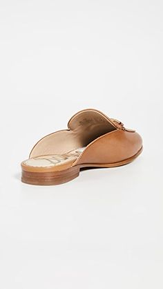 Sam Edelman Linnie Mules | SHOPBOP Flat Calf Leather Slip-ons With Leather Sole, Calf Leather Slip-ons With Removable Insole And Flat Heel, Elegant Brown Slip-on Slippers, Chic Closed Toe Slip-ons With Branded Insole, Designer Leather Slip-ons For Work, Office Slip-ons In Calf Leather, Elegant Slip-on Mules With Stitched Sole, Calf Leather Slip-on Flats With Stitched Sole, Classic Calf Leather Slip-ons With Flat Heel