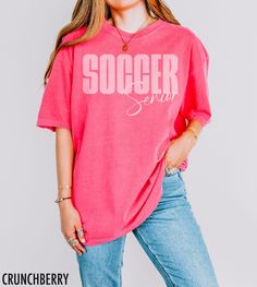 Soccer Shirt for back to school. Customize this shirt with your sport, year, and/or name.  For example: Soccer Emily or  Soccer Senior We use professional quality DGT printing on all our apparel. Direct-to-garment, or DTG, is a high quality printing method that sprays ink directly onto the garment so there is no peeling or cracking. This fabulous graphic will be printed on a Comfort Colors Unisex T-Shirt. Please refer to the size charts in the images for the best fit.  Production Time: 1-5 days School Fan Apparel Crew Neck Top, School Fan Apparel Tops With Crew Neck, School Fan Apparel Top With Screen Print, Pink Short Sleeve Tops With Team Name, Pink Letter Print Tops For College, Team Spirit Short Sleeve School Top, School Team Spirit Short Sleeve Top, Team-colored Tops For School Sports Season, Team-colored Top For School Sports Season