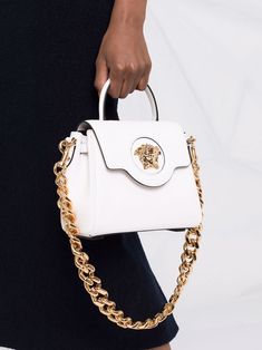 White Double Handle Shoulder Bag With Logo Hardware, White Bags With Double Handle And Logo Hardware, Luxury Tote Satchel With Logo Hardware, White Rectangular Shoulder Bag With Logo Hardware, White Tote Shoulder Bag With Logo Hardware, White Shoulder Bag With Logo Hardware For Everyday Use, White Shoulder Bag With Logo Hardware For Shopping, White Bag With Gold-tone Hardware And Round Handle, White Bags With Gold-tone Hardware And Round Handle