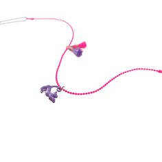 "Purchase the Calico Sun™ Cat Zoey Necklace at Michaels. com. For the kitten-loving person, this beautiful pink ball chain necklace features an enamel coated purple cat charm with delightful pink and purple tassels that bring the complementary colors of the necklace together. For the kitten-loving person, this beautiful pink ball chain necklace features an enamel coated purple cat charm with delightful pink and purple tassels that bring the complementary colors of the necklace together. Adjustab Playful Pink Charm Necklace For Friendship, Playful Pink Charm Necklaces For Friendship, Playful Pink Charm Necklaces, Playful Pink Jewelry With Removable Charms, Pink Adjustable Necklace For Friendship, Pink Dangle Charm Necklace With Adjustable Chain, Purple Pendant Necklaces With Charms, Purple Pendant Necklace With Charms, Playful Purple Dangle Jewelry