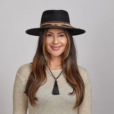 Moonshine | Womens Felt Fedora Hat brings a touch of bohemian elegance with its flat brim and rancher-style teardrop shape. Crafted from firm wool felt, it features a beaded half band with a chinstrap and turquoise tassel, perfect for women seeking a stylish, unique statement piece. Material: Heavyweight Firm Wool Felt Shape: Rancher Teardrop Trim: Rustic Frayed Fabric Band with Turquoise Tassel and Beads Brim Size: 3" Crown Height: 4” Features: Beaded Chin Cord Sweatband: AHM Velcro Imported White Fedora Hat, Womens Fedora Hat, White Fedora, Frayed Fabric, American Hat Makers, American Hat, Dead Of Night, Pork Pie Hat, Womens Fedora