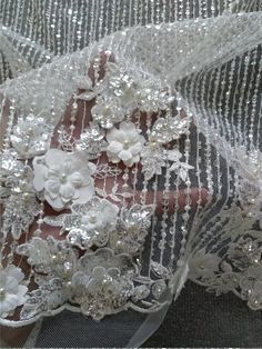 "This stunning Lace Fabric design piece has soft hand feel, It's perfect for weddings, bridal parties, and any events. Shop our large inventory of bridal fabrics. ☆PRODUCT DESCRIPTION : This gorgeous fabric is made on a sheer base with a beautiful flower embroidery and delicate beaded throughout. The fabric width is approximately 51\" (130cm) Wide. Color: off white or beige as in picture Material: Rayon, Polyester, Pearls, Sequins ☆ PURCHASING INFORMATION: This fabric is sold by the yard and eac Wedding Dress With 3d Embroidery In Organza, Elegant Floral Applique Wedding Gown, Wedding Gown With Floral Embroidery And Tulle Material, Floral Embroidered Tulle Gown For Wedding, Wedding Organza Gown With Floral Embroidery, Wedding Gown With Floral Embroidery In Organza, Organza Wedding Gown With Floral Embroidery, Floral Applique Organza Gown For Wedding, Organza Gown With Floral Applique For Wedding