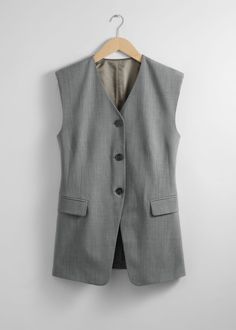 Tailored vest with a single-breasted finish and padded shoulders.• V-cut neckline• Duo welt pockets• 51% RWS Wool certified by Control Union 1201053• Length of vest: 75cm / 29.5" (EU 36 / UK 8 / US 4) Chic Vest With Welt Pockets, Spring Vest With Notch Lapel And Welt Pockets, Tailored Office Vest With Welt Pockets, Tailored Vest With Welt Pockets For Office, Tailored Business Casual Vest With Pockets, Sleeveless Tailoring Vest With Welt Pockets, Business Vest With Welt Pockets, Classic Spring Vest With Welt Pockets, Tailored Vest With Pockets For Business Casual