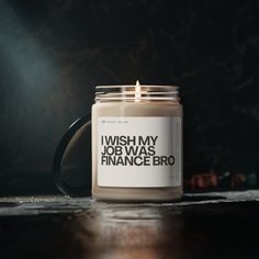 a candle with the words i wish my job was finance bro printed on it sitting on a table