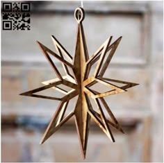 a wooden star ornament hanging from a string on a door hanger with qr code in the background