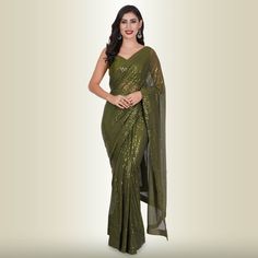 Introducing the One Minute Sequin Saree in Dark Green, a masterpiece crafted from luxurious georgette. This saree is not just a garment; it's an experience in effortless elegance. With a pre-stitched blouse that guarantees a perfect fit, getting ready has never been this convenient.The saree belt adds a touch of grace and sophistication to your ensemble, transforming you into the epitome of style in minutes. The mesmerizing sequin work catches the light in all the right ways, ensuring you shine Reception Outfits, Saree With Belt, Sequin Saree, Sari Blouse, Single Piece, Exclusive Collection, Salwar Kameez, Indian Outfits, Dark Green