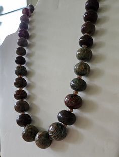 Hand-painted beads from Nigeria. Blue and brown Hand made Necklace. If you have any questions, comments, or concerns please feel free to reach out! Unique Brown Beaded Necklace With Polished Beads, Unique Brown Necklaces With Colorful Beads, Brown Necklaces With Colorful Oval Beads, Unique Brown Polished Beads, Brown Beaded Necklaces With Oval Beads, Brown Beaded Necklace With Colorful Oval Beads, Brown Beaded Necklace With Oval Beads, Brown Polished Beads For Jewelry Making, Bohemian Brown Beaded Necklaces With Oval Beads