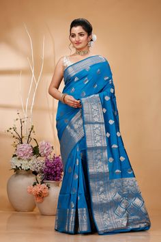 Elevate your ethnic wardrobe with this Exquisite Handwoven Banarasi Saree, a masterpiece of traditional Indian craftsmanship. Made from premium quality silk, this saree features intricate Zari work that showcases the rich cultural heritage of Banaras. Perfect for weddings, festivals, and special occasions, this Banarasi saree exudes elegance and sophistication. Each saree is meticulously handcrafted by skilled artisans, ensuring that every piece is unique and of the highest quality. The luxurious silk fabric drapes beautifully, providing a timeless and graceful look. The rich colors and detailed patterns make this saree a standout choice for any festive celebration or formal event. Saree Type: Banarasi Handloom Pure Silk Antique Zari Kaduwa Butta and Borders Sarees Saree Length: 5.5 Meters Eid Traditional Wear With Pallu In Slub Silk, Eid Slub Silk Traditional Wear With Pallu, Festive Traditional Wear With Traditional Fit And Drape, Paithani Silk Traditional Wear For Diwali, Blue Slub Silk Traditional Wear For Puja, Slub Silk Traditional Wear For Puja And Eid, Banarasi Silk Traditional Wear With Meenakari For Diwali, Slub Silk Traditional Wear For Diwali, Diwali Traditional Wear In Banarasi Silk With Meenakari