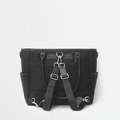 This lightweight structured tote is the perfect work bag, travel bag, and go anywhere bag. It features a spacious and organized interior for your essentials, a padded compartment for a 15 inch laptop (and 16 inch Macbook Pro), side pockets for your drinks, and you can convert it into a backpack or crossbody. Functional Diaper Bag With Double Handle For On-the-go, Rectangular Nylon Satchel For On-the-go, Large Capacity Nylon Satchel For On-the-go, Modern Travel Bag With Double Handle For On-the-go, Modern On-the-go Tote Luggage, Large Capacity Nylon Laptop Bag For On-the-go, Functional Commuter Bags With Luggage Sleeve, Functional Bags With Luggage Sleeve For Commuting, Functional Commuting Bags With Luggage Sleeve