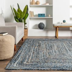 a living room filled with furniture and a blue rug