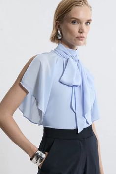 Feminine Tie Neck Tops For Office, Feminine Bow Top For Fall, Spring Workwear Blouse With Bow, Spring Party Blouse With Tie Sleeves, Fall Tie Neck Top With Bow Detail, Fall Tie Neck Top With Bow, Formal Sleeveless Top With Bow, Fall Bow Tie Neck Top, Tie Neck Tops With Bow For Work