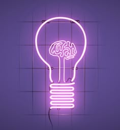 a neon light bulb with a brain in it's center on a purple background