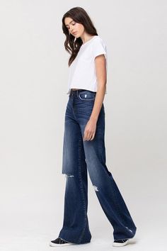 Elevate your denim game with these Flying Monkey High Rise Distressed Wide Leg Jeans. These jeans boast a high-rise waist for a flattering silhouette, while the wide leg design adds a touch of retro elegance. The distressed detailing infuses an edgy element, making these jeans a versatile choice to effortlessly combine modern trends with a hint of vintage-inspired style.F. Rise: 10"Inseam: 34'' Leg Opening: 22''Model is 5' 8'' Wearing size26Fabric Contents: 93% Cotton, 5% Polyester, 2% Spandex, Casual Cropped Flare Jeans With Frayed Hem, Casual High Rise Medium Wash Flare Jeans, High Rise Dark Wash Pants With Frayed Hem, Fall Distressed Wide Leg Bottoms, Dark Wash Cropped Relaxed Fit Flare Jeans, Cropped Dark Wash Relaxed Fit Flare Jeans, Casual Cropped Denim Blue Flare Jeans, Dark Wash Cropped Flare Jeans With Relaxed Fit, Cropped Dark Wash Cotton Flare Jeans