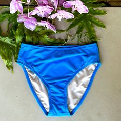 These Beautiful Powder Blue Bikini Bottom Have 3 1/2” Sides And Are Fully Lined. The Bottoms Have Moderate Rear Coverage And Come Straight Across Just Below The Waist. See Photo’s Above For Measurements. All Measurements Are Approximate With Photo’s Taken With Garment Laying Flat, No Stretch. High Waist Blue Bottoms For Pool, Blue Beachwear Bottoms For Beach Party, Blue Summer Bottoms For Beach Party, Blue Summer Bottoms For Sunbathing, Blue Bottoms For Sunbathing In Summer, Blue High-waist Bottoms For Poolside, Blue High Waist Bottoms For Poolside, Blue Bottoms For Pool Beach Season, Vacation Blue Brief Bottoms