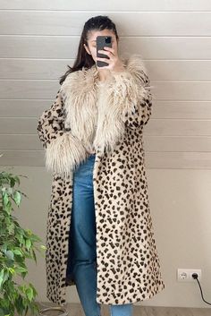 Stay warm and stylish in winter in this Leopard Print Faux Fur Coat. Super soft and thick faux fur and fluffy collar and cuffs make this coat cozy and warm. Beige Faux Fur Coat For Fall, Oversized Beige Fur Coat For Winter, Fluffy Beige Fur Coat For Fall, Cream Long Fur Coat With Faux Fur Lining, Winter Leopard Print Faux Fur Outerwear, Leopard Print Outerwear With Faux Fur Trim, Winter Leopard Print Outerwear With Faux Fur Trim, Cream Faux Fur Coat For Winter, Leopard Print Faux Fur Coat With Lining