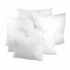 six white pillows stacked on top of each other