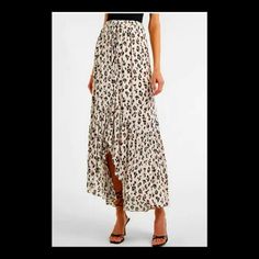 Oduct Details Description A Fiercely Fabulous Maxi Style For The Season Thanks To A High Rise, Bold Animal Print And Hi-Lo Hem. Dress This One Up Or Down. Features & Fabric High Waisted Drawstring Waistband Leopard Print; Textured Crinkle Fabric Hi-Lo Ruffle Hem; Maxi Length Chic Cream Floral Print Bottoms, Chic Cream Maxi Skirt For Summer, Cream Maxi Skirt For Summer Day Out, Chic Rayon Skirt For Brunch, Casual Cream Skirt With Floral Print, Casual Cream Floral Print Skirt, Chic White Maxi Skirt With Floral Print, Casual Cream Maxi Skirt, Trendy White Maxi Skirt For Day Out