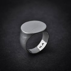 A handmade sterling silver 925 blank round signet stamp ring.Each ring is cleaned and polished with care.The weight of the ring may vary according to size.Top measurements: Width - 17mm | Height - 17mmApprox weight:  9.12grThe ring is made of sterling silver 925 and is water resistant.This awesome signet ring is available in more shapes! Click here to see:Rectangle: https://www.etsy.com/il-en/listing/543815352/rectangle-sterling-silver-signet-ringOctagon: https://www.etsy.com/il-en/listing/54381 Minimalist Open Signet Ring With Engraving Option, Modern Rings With Engraving Option, Modern Adjustable Signet Ring, Modern White Gold Round Signet Ring, Everyday Silver Signet Ring With Engraving Option, Sterling Silver Polished Signet Ring, Minimalist Oval Signet Ring With Engraving Option, Sterling Silver Rounded Signet Ring With Polished Finish, Sterling Silver Signet Ring With Polished Finish